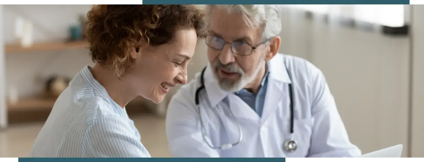 Patient reviewing GI procedure preparation instructions with a gastroenterology provider